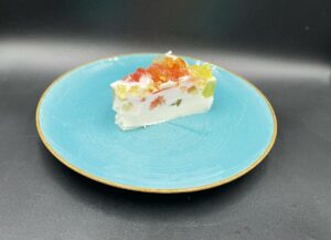 A no-bake Polish yogurt cake on a blue plate.