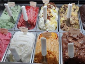 Gelato vs Ice Cream: Isnt it the same thing? Image 3 jpeg several trays of gelato lined up with ice cream scoops frosted fusions