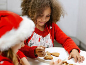 12-irresistible-christmas-ice-cream-recipes-for-your-holiday-table-image-3-chridren-making-cookies-with-christmas-hats-on-frosted-fusions