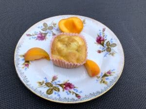 Fresh peaches on a plate.