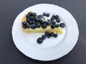 A tart with blueberries and lemon.