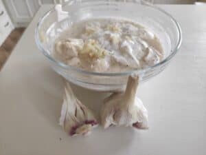 A bowl of Polish cuisine with garlic and cream.