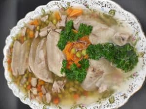 Pork or beef jelly in a white dish.