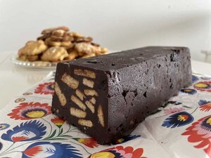 A delicious piece of chocolate cake, a popular dessert in Polish cuisine, is sitting temptingly on a table.