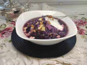 Polish red cabbage soup with sour cream and walnuts.