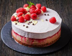 learn-how-to-make-homemade-ice-cream-cakes-image-6-homemade-ice-cream-cake-showing-layers-of-cake-and-ice-cream-and-topped-with-fresh-raspberries-almonds-and-chocolate-frosted-fusions