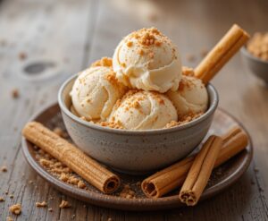 Homemade-Cinnamon-Churros-Ice-Cream-Spice-and-Crispy-Comfort-image-4-scoop-of-Cinnamon-ice-cream-with-cinnamon-dusted-over-frosted-fusions