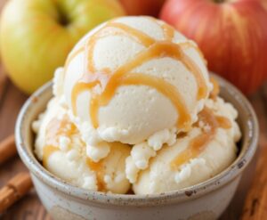 5-Delicious-Autumn-Inspired-Ice-Cream-Recipes-That-Taste-Like-A-Hug-Image-5-Apple-butter-ripple-ice-cream-with-golden-swirls-and-autumn-leaves-Frosted-Fusions