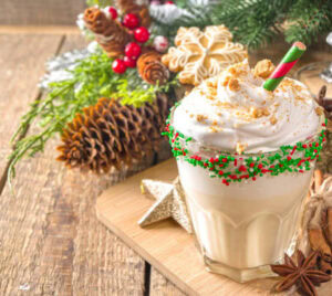 12-irresistible-christmas-ice-cream-recipes-for-your-holiday-table-image-1-ice-cream-sundae-with-sprinkles-ans-festive-decor-in-the-background-frosted-fusions