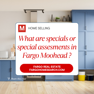  A promotional image featuring a kitchen with blue cabinets, a countertop with plants and kitchen items, and a white overlay box. The box contains red and white text reading "HOME SELLING: What are specials or special assessments in Fargo Moorhead?" with a red button labeled "FARGO REAL ESTATE.COM" and a website URL "fargohomesearch.com" at the bottom.