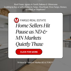 Real estate marketing graphic featuring the headline &ldquo;Home Sellers Hit Pause as ND & MN Markets Quietly Thaw&rdquo; with a Modern Market REALTORS&reg; logo, red call-to-action button, and a staged kitchen background promoting the Fargo&ndash;Moorhead and greater North Dakota&ndash;Minnesota housing market update.