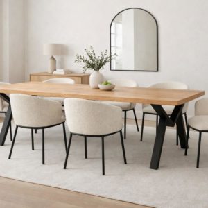 Modern solid pine dining table with black metal Mensa Table co M-Style legs, styled in a neutral dining room with six cream boucle chairs.