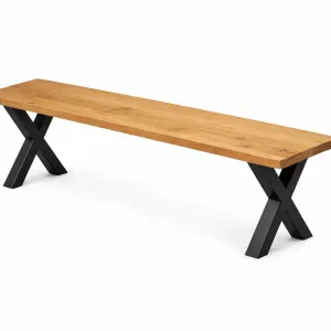 Solid oak dining bench with black metal X-legs on a white background
