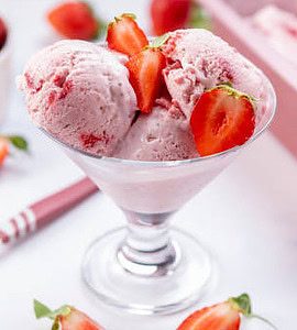 diabetes-and-ice-cream-making-healthier-choices-image-5-jpeg-strawberry-ice-cream-in-glass-dish-with-spoon-and-fresh-strawberries-scattered-around-frosted-fusions