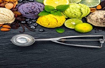 Dairy-Free Delights Creating Rich Homemade Vegan Ice Cream featured image 200x600w various scoops of differently coloured ice creams with an array of fresh ingredients used to make plus silver ice cream scoop frosted fusions
