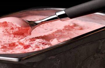 Mastering-Homemade-Ice-Cream-Using-Ice-Cream-Makers-Techniques-and-Tips-featured-image-200x695w-tray-of-pink-ice-cream-being-scooped-with-baller-frosted-fusions