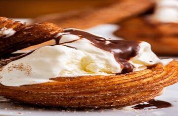 Homemade-Cinnamon-Churros-Ice-Cream-Spice-and-Crispy-Comfort-featured-image-200x600w-Churros-and-scoop-of-ice-cream-with-chocolate-sauce-frosted-fusions