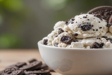 An-Irresistibly-Easy-Homemade-Oreo-Ice-Cream-Recipe-featured-image-white bowl of Oreo Ice Cream with Oreo cookies-frosted-fusions