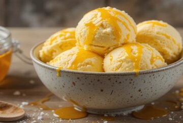 Honey & Mustard Ice Cream – A Unique, Sweet & Savoury Scoop! Featured image 637x1920w bowl of honey & mustard ice cream with jar of honey and dish of mustard Frosted Fusions
