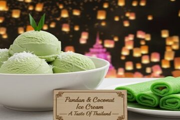 Pandan-Coconut-Ice-Cream-Featured-Image-Bowl-of-green-ice-cream-and-pandan-crepes-with-Thai-lantern-festival-backdrop-Frosted-Fusions