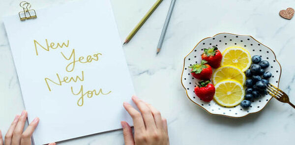 New Year New You Discover Guilt-Free Homemade Ice Cream to Indulge image 2 sign saying new year new you with plate of fresh fruit frosted fusion