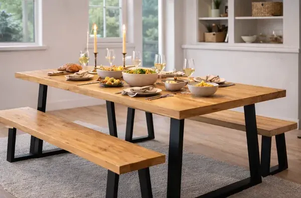Solid Swedish pine dining table and benches with black metal legs set for family dinner &ndash; side view&rdquo;