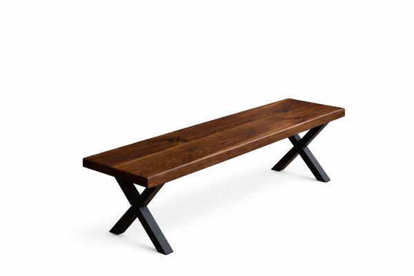 Solid American walnut wood bench with black X-shaped metal legs on a white background