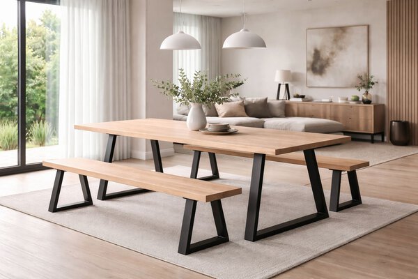 Modern dining and living area featuring a solid ash table with matt black steel legs and coordinating wooden benches