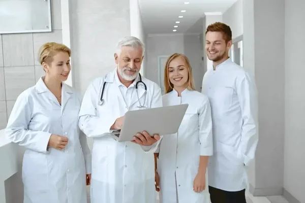 Doctors collaborating in a modern healthcare setting to improve patient care and teamwork.