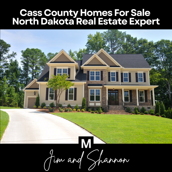 Banner for Cass County Homes For Sale page featuring a two-story suburban home with text overlay &ldquo;Cass County Homes For Sale &ndash; North Dakota Real Estate Expert&rdquo; and &ldquo;Jim and Shannon.&rdquo;