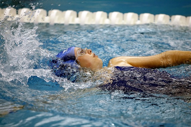 a child swimming backstroke