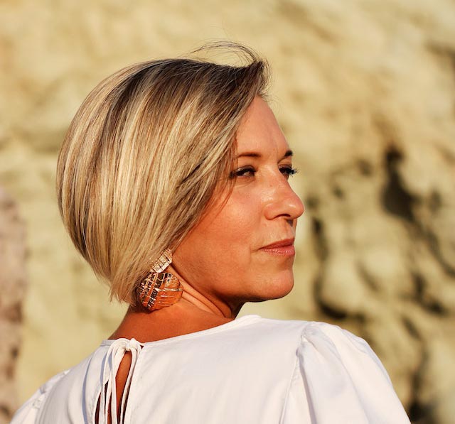 middle-aged-woman-looking-reflectively-over-her-shoulder