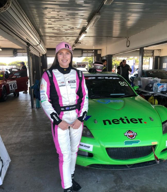 Race car driver Maisie Place wearing Netier Pink Cap