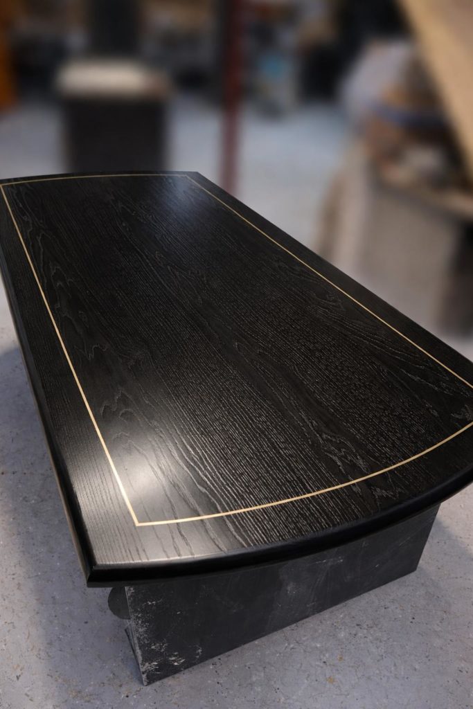 Stunning hand crafted solid ash table top with black policy oil and gold inlay strip