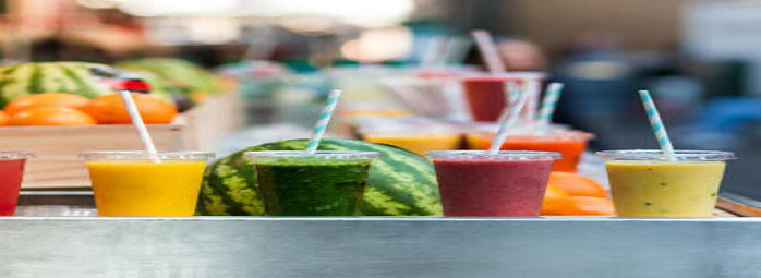 new-year-fresh-vibes-nourish-your-body-with-healthful-smoothies-image-1-6-smoothies-lined-up-all-different-colours-and-mixtures-with-fresh-fruit-in-the-background-frosted-fusions