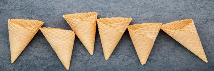Mastering-the-Art-Make-Homemade-Ice-Cream-Cones-featured-image-200x600w-6-ice-cream-cones-laid-out-dark-background-frosted-fusions