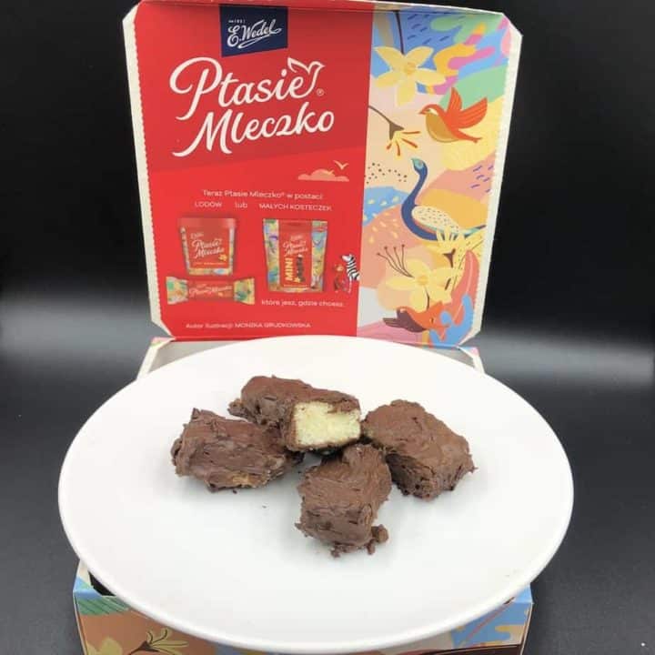 A homemade piece of chocolate on a plate next to a box.