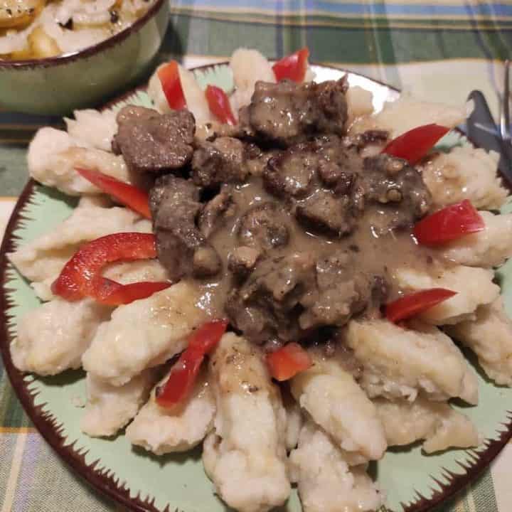 Szare kluchy dumplings with meat and veggies.