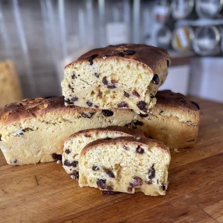 A loaf of raisin bread on a cutting board, representing a delicious example of Polish cuisine.