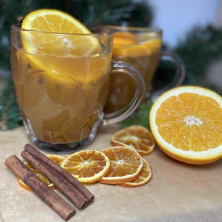 Polish mulled beer with orange slices and cinnamon sticks.