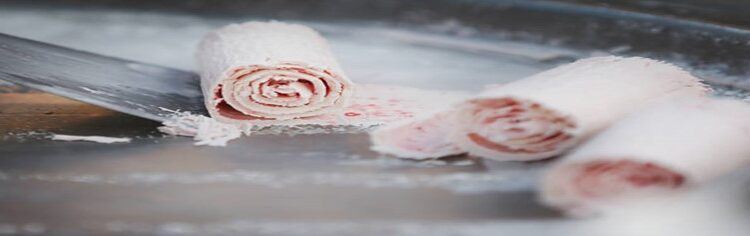 From-Scoop-To-Roll-Learn-To-Create-Your-Own-Homemade-Ice-Cream-Rolls-featured-image-200x650w-three-ice-cream-rolls-being-made-on-frozen-plate-with-spatula-rolling-one-frosted-fusions