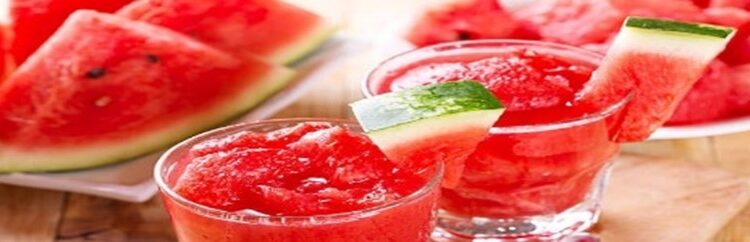 Watermelon-Sorbet-Granita-–-A-Refreshing-Taste-Of-Spring-featured-image-280x1000w-watermelon-sorbet-in-glasses-with-fresh-watermelon-wedges-in-the-background-Frosted-Fusions