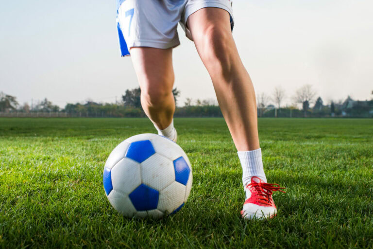 Image of female footballer's legs with a close up on knees