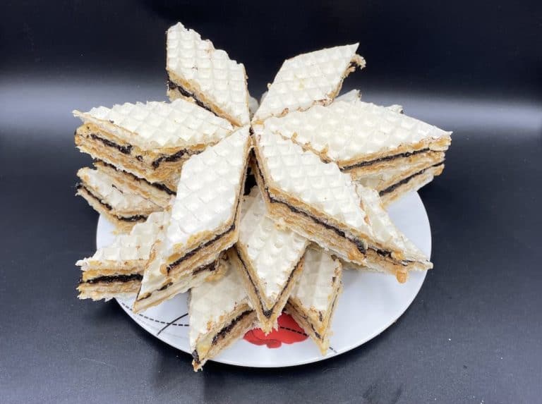 A plate with a star shaped andrut dessert on it.