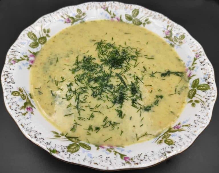 Creamy cucumber soup with a sprinkle of fresh dill on top.