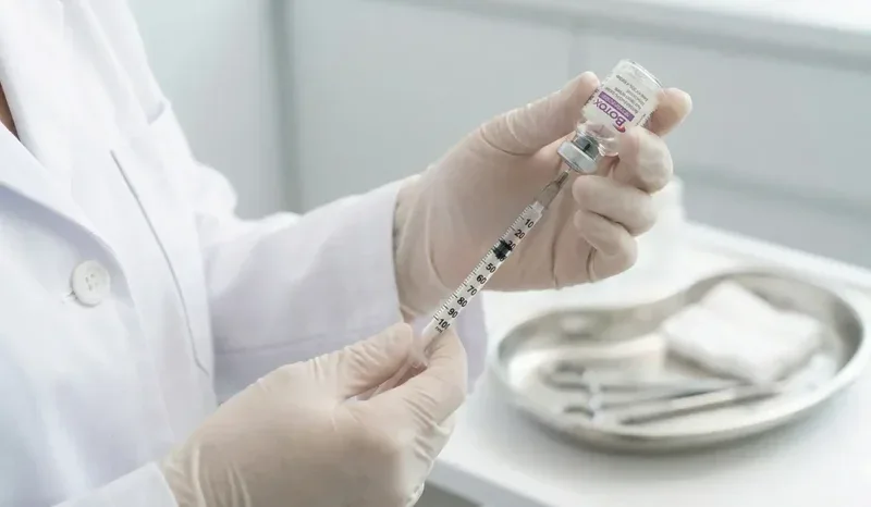doctor preparing botox syringe closeup