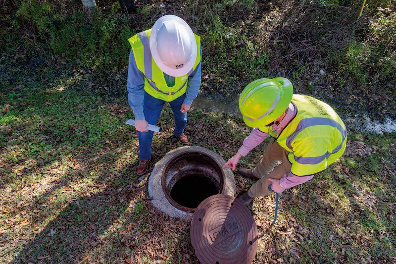 Workers rehabilitate manholes as part of Phase 1 of Beaumont, Texas' sanitary sewer overflow initiative. (Photo credit: LAN)