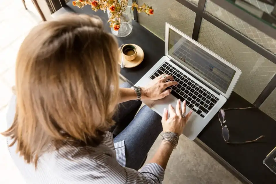 Person typing on laptop at a desk