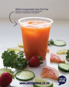 A clear PLA cup made from corn starch containing carrot juice
