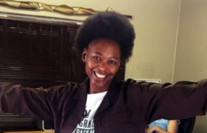 smiling woman with an afro